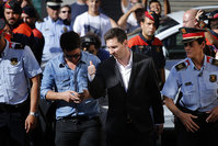 Barcelona F.C. soccer player Lionel Messi, centre right, gestures, as he arrives at a court to answer questions in a tax fraud case, in Gava, near Barcelona (AP Photo)