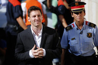 In this Sept. 27, 2013 file photo, FC Barcelona star Lionel Messi, left, arrives at a court to answer questions in a tax fraud case in Gava, near Barcelona, Spain. (AP Photo)