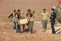 A group of Syrian Turkmen fighters are seen at the Havar Kilis region of Azaz, Syria.