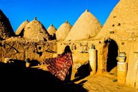 A journalist from Ankara is observing a historical house in the Harran district of u015eanlu0131urfa. The site, which used to receive around 1,000 visitors a day last year, is now only seeing several tourists a week.