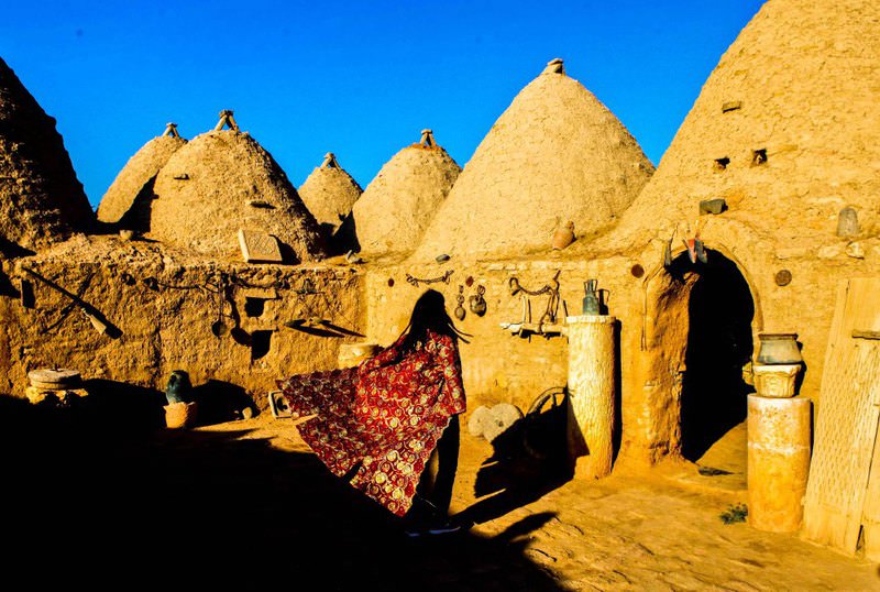 A journalist from Ankara is observing a historical house in the Harran district of u015eanlu0131urfa. The site, which used to receive around 1,000 visitors a day last year, is now only seeing several tourists a week.