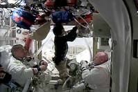 This October 28, 2015 NASA TV image shows US astronauts Kjell Lindgren(L) and Scott Kelly after entering the International Space Station following a spacewalk that lasted more than seven hours. (AFP Photo)