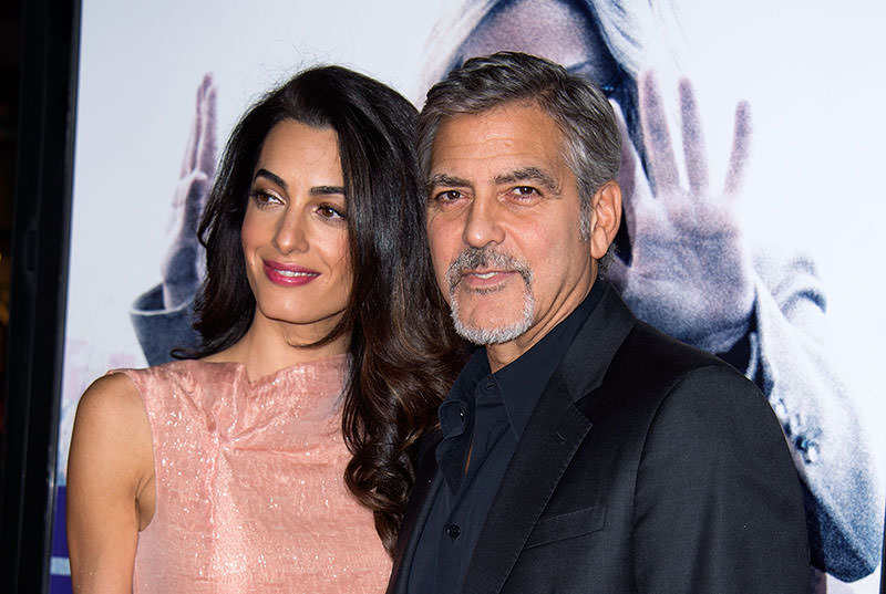 Amal Clooney (L) and Producer/actor George Clooney attend Premiere of ,Our Brand is Crisis, in Hollywood, California, on October 26, 2015. (AFP photo)