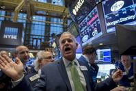 Traders gather as New York Stock Exchange (NYSE) Floor official Rudy Mass (C) opens Pfizer's stock on the floor of the NYSE on Friday. 