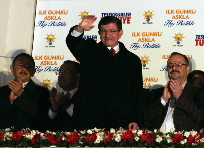 Prime Minister Ahmet Davutou011flu salutes supporters gathered outside AK Party headquarters in Ankara, Turkey, Sunday, Nov. 1, 2015.  (AP Photo)