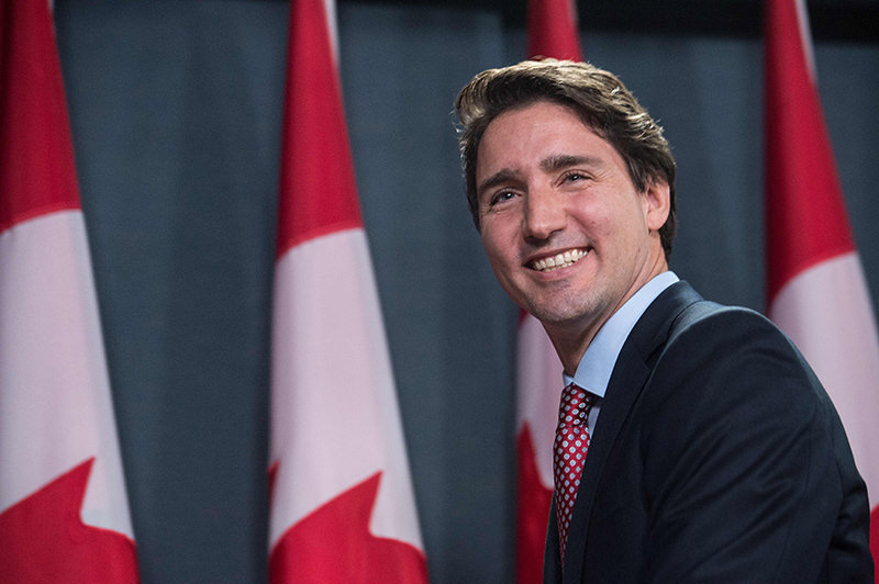 Canadian Liberal Party leader Justin Trudeau smiles at the end of a press conference in Ottawa on October 20 (AFP Photo)