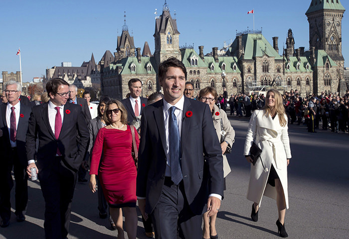 PM Trudeau and his newly sworn-in cabinet ministers arrive on Parliament Hill in Ottawa on Wednesday October 31, 2015 (AP Photo)