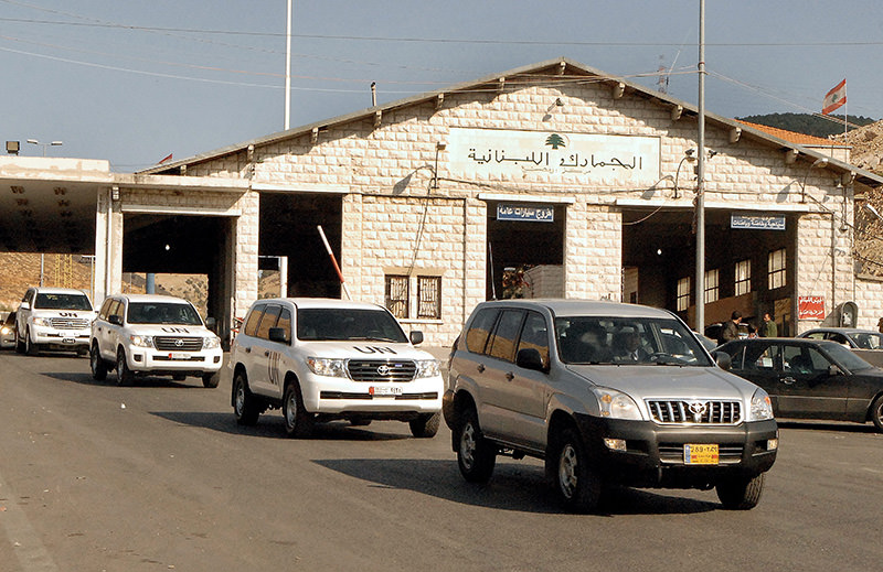  A file photo dated 30 September 2013 shows a convoy of UN vehicles carrying the UN team of inspectors investigating the alleged use of chemical weapons in Syria crossing into Lebanon from Syria (EPA Photo)