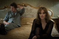 This photo provided by Universal Pictures shows, Brad Pitt, left, as Roland and Angelina Jolie Pitt as Vanessa in a scene from the film ,By the Sea,, directed by Jolie Pitt. (AP Photo)