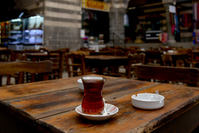 A cup of Turkish tea is placed on a table at the Hasan Pasa caravansary in Diyarbakir on October 1, 2015. (AFP Photo)