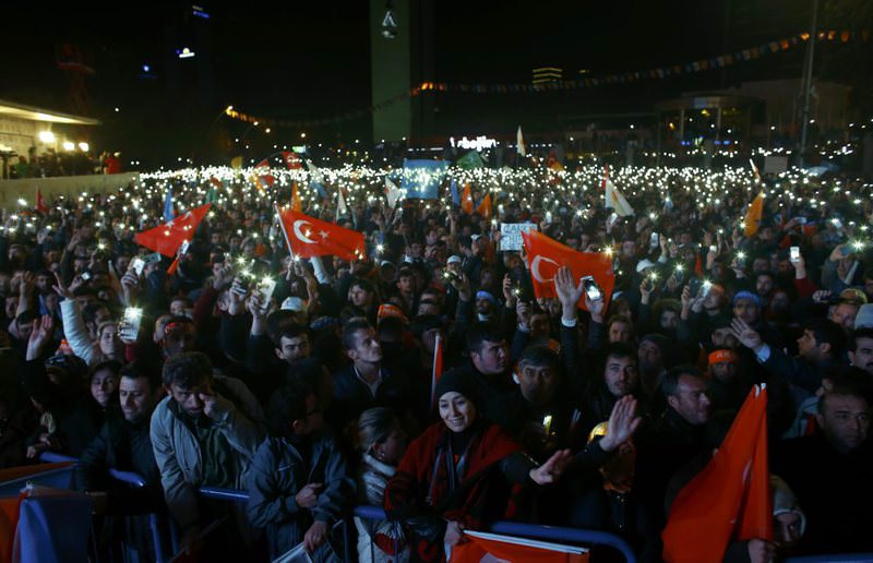 AK Party supporters waving party and national flags as they celebrate their party's victory in the Nov. 1 elections in front the AK Party headquarters in Istanbul.
