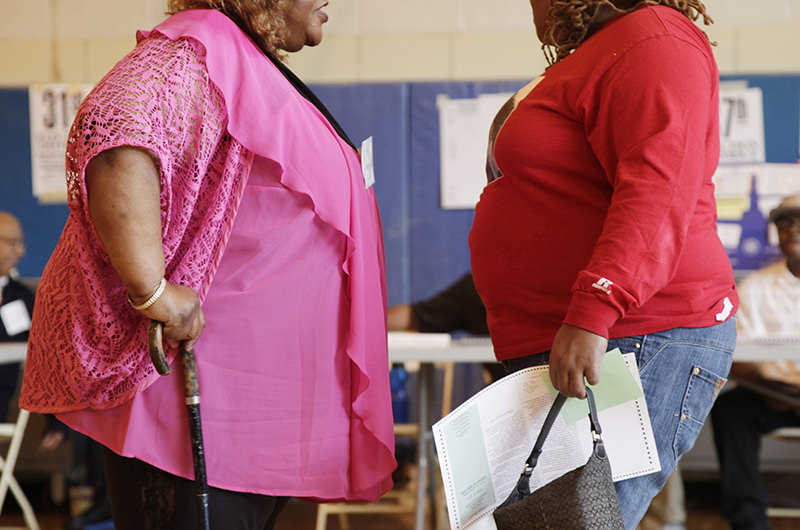  In this file photo dated Tuesday, June 26, 2012, two overweight women hold a conversation in New York, USA. (AP Photo)
