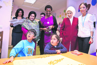 First lady Emine Erdou011fan (2R) visits Du00f6u015femealtu0131 Metropolitan School for Special Education and Rehabilitation Center with the Zimbabwean President's wife Grace Mugabe (C) and Malaysian Prime Minister's wife Rosmah Mansor (L).