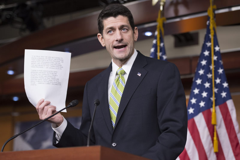 Speaker of the House, Republican Paul Ryan, holds a sheet of paper with quotes from the Congressional testimony of FBI Director James Comey and Homeland Security Secretary Jeh Johnson. (EPA Photo)