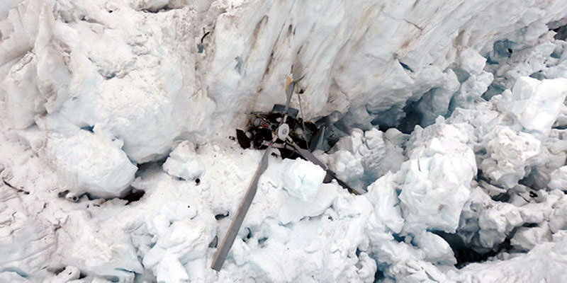 In this photo provided by New Zealand Police, the wreckage of a helicopter carrying tourists is seen crashed in a crevasse on Fox Glacier, a scenic glacier in South Island, New Zealand (AP Photo)