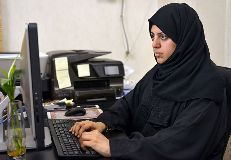 Nassima al-Sadah, a candidate for municipal councils in the Gulf coast city of Qatif, working at her office in Qatif 400 kilometers east of Riyadh (AFP photo) 