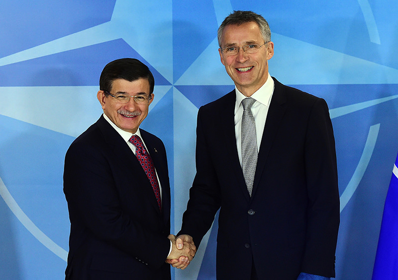 Prime Minister Ahmet Davutoglu (L) meets with NATO Secretary General Jens Stoltenberg at the NATO headquarters on November 30, 2015 in Brussels (AFP Photo)