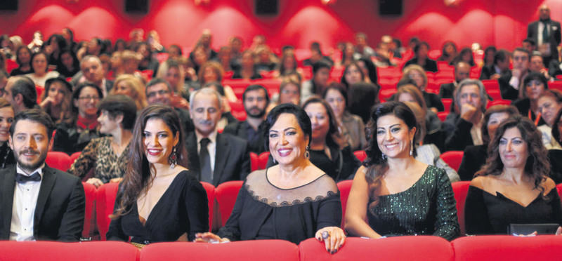 Legendary Turkish actress and director Tu00fcrkan u015eoray (center) attended the gala with her daughter Yau011fmur u00dcnal (L) and the film crew of ,Uzaklarda Arama.,