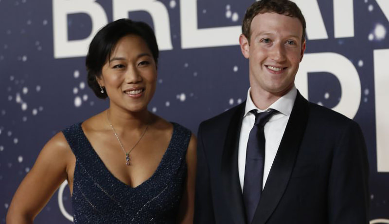 Mark Zuckerberg (R), founder and CEO of Facebook, and wife Priscilla Chan arrive on the red carpet during the 2nd annual Breakthrough Prize Award in California. (REUTERS Photo)