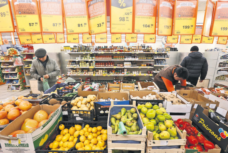 Fruits, vegetables and other products are seen on sale at a grocery store of the food retailer Dixy in Moscow. Russia bans Turkish food exports to revenge downed warplane by Turkey last week.