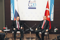 Russian President Putin (L) and his Turkish counterpart Erdou011fan pose for the media before their talks during the G20 Summit in Antalya on Nov. 16.