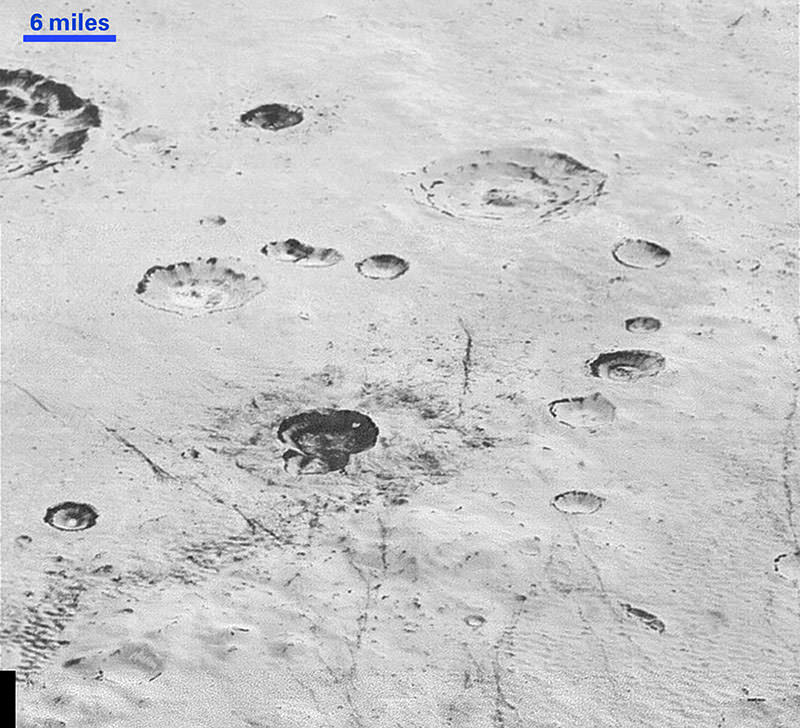 This handout picture obtained from NASA on December 5, 2015 shows an image taken from NASA's New Horizons spacecraft showing new details of Plutou2019s rugged, icy cratered plains (AFP photo)