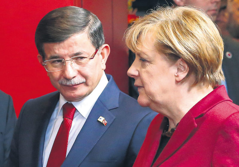 Prime Minister Davutou011flu (L) with German Chancellor Merkel at the Turkish-EU summit on Nov. 29 in Brussels where the two sides reached an agreement to collaborate in resolving the refugee crisis.