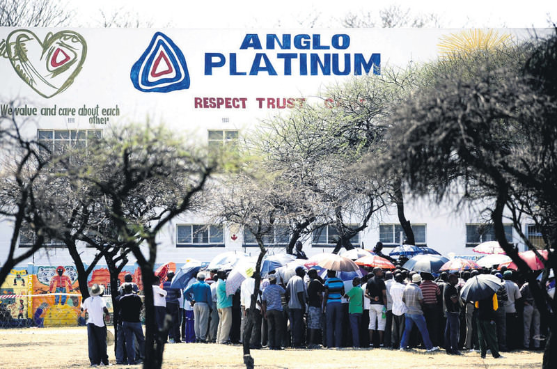 A picture taken on Oct. 5, 2012, shows striking mine workers gathering outside the Anglo American Platinum (Amplats) Mine in Rustenburg, South Africa.
