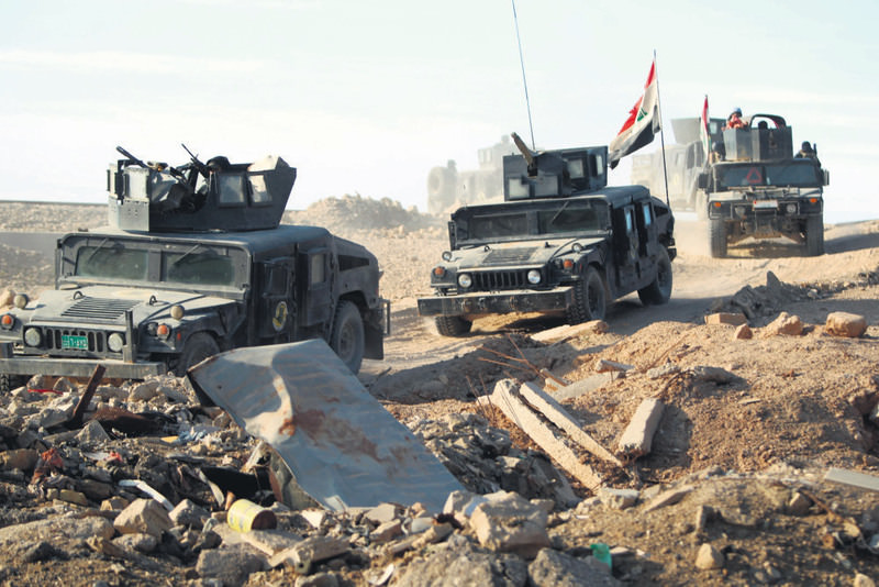 Iraqi counter-terrorism forces drive in the Tameem district of Ramadi, a large city on the Euphrates 100 kilometers west of Baghdad on Dec. 9.