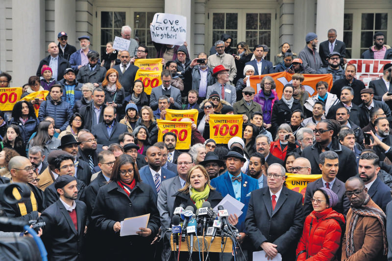 New York City Council Speaker Melissa Mark-Viverito, center, speaks during an interfaith rally at New York's City Hall in response to Trump's call to block Muslims from entering the United States.