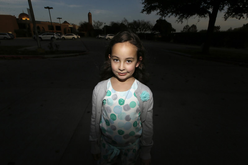 Sofia Yassini, 8, poses for a photo outsider a mosque in Richardson, Texas, Friday, Dec. 11, 2015. (AP Photo)