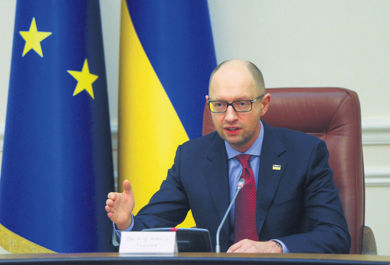 Ukrainian Prime Minister Arseniy Yatsenyuk at his cabinet meeting in Kiev on Friday. Ukraine declared a moratorium on paying back the $3 billion it borrowed from Russia in 2013, Yatsenyuk told his cabinet of ministers.