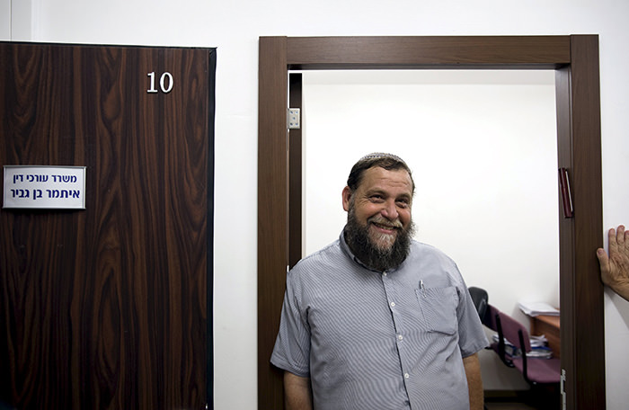 Benzion Gopshtein, leader of the far-right Israeli group Lehava, stands inside his lawyer's office before a news conference in Jerusalem, in this August 11, 2015 (Reuters Photo)