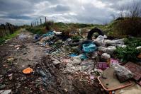 In this Nov. 18, 2013 photo, rubbish is piled up on the edge of cultivated land near Caivano, in the surroundings of Naples, southern Italy. (AP Photo)