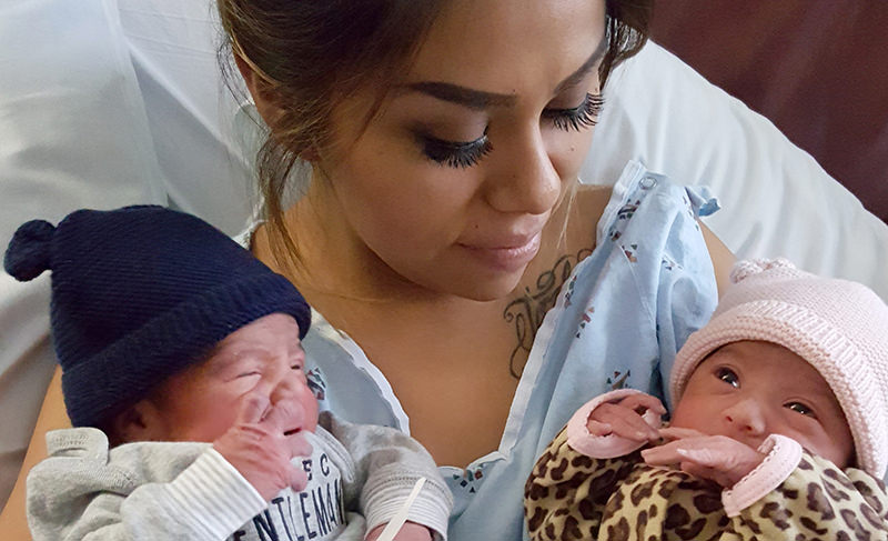 This Jan. 1, 2016 photo provided by Kaiser Permanente San Diego shows Maribel Valencia holds her newborn twins at the San Diego Kaiser Permanente Zion Medical Center in San Diego (AP Photo)