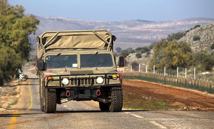 An Israeli military vehicle patrols along the Israeli-Lebanese border, near the village of Ghajar, 21 December 2015 (EPA Photo)