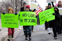 People walk from the U.S. Capitol to the Washington Monument in Washington, Saturday, Jan. 26, 2013, during a march on Washington for gun control. (AP Photo)
