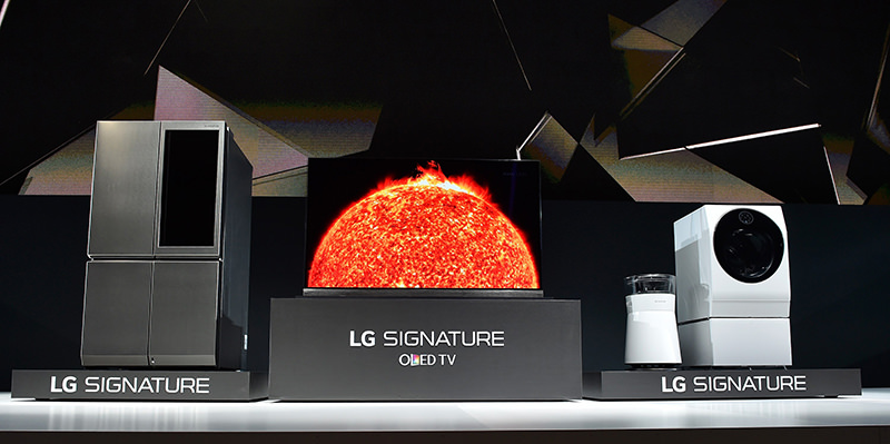 The LG Signature refrigerator, HDR-enabled OLED 4K TV, air purifier and washing machine are displayed during a LG press event  (AFP Photo)