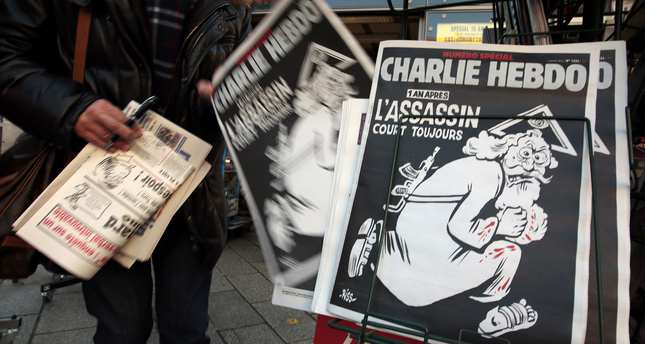 Charlie Hebdo depicts 'God' as a gun-wielding, bloodstained terrorist ...