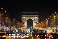 Christmas decorations illuminate the Champs Elysees, as the Arc de Triomphe is seen in the background, in Paris, Monday, Dec. 14, 2015. (AP Photo)