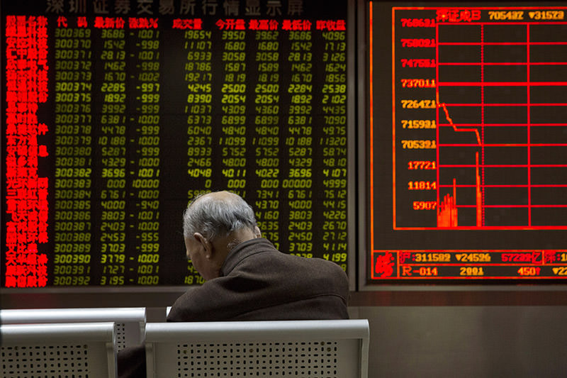 Chinese stocks nosedived on Thursday, triggering the second daylong trading halt of the week and sending other Asian markets sharply lower as investor jitters rippled across the region. (AP Photo)