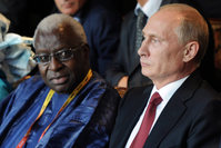 Russian President Vladimir Putin and IAAF President Lamine Diack attend the opening ceremony for the World Athletics Championships at the Luzhniki Stadium in Moscow in Aug. 10, 2013.