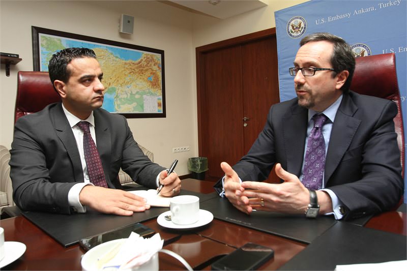 Daily Sabah's Ankara representative Ali u00dcnal (L) with U.S. ambassador to Ankara John Bass.