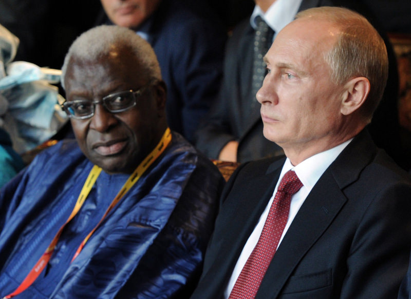 Russian President Vladimir Putin and IAAF President Lamine Diack attend the opening ceremony for the World Athletics Championships at the Luzhniki Stadium in Moscow in Aug. 10, 2013.