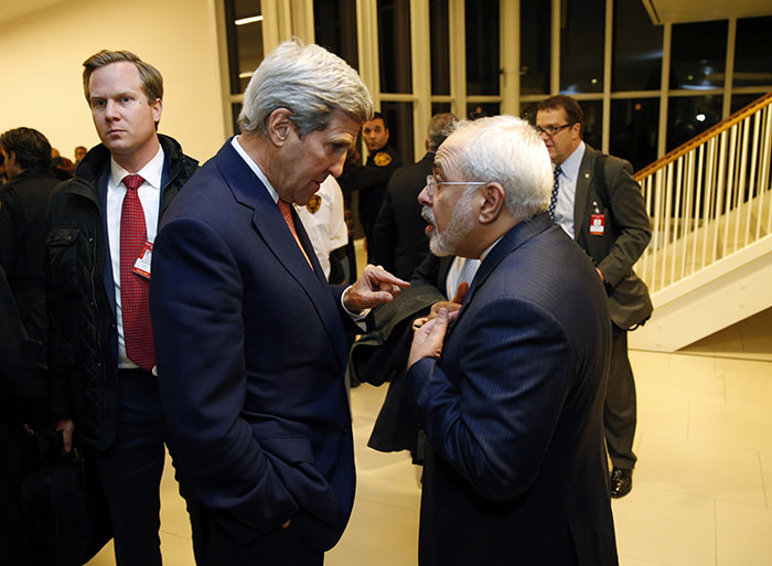 U.S. Secretary of State John Kerry talks with Iranian Foreign Minister Mohammad Javad Zarif (AP Photo)