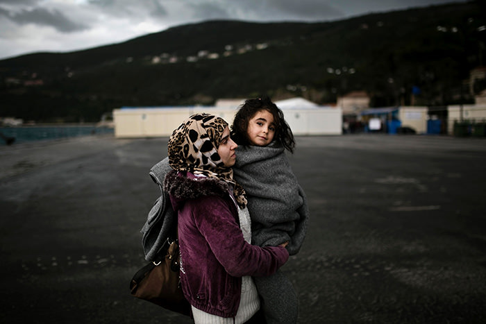 Syrian woman and her baby on the Greek island of Samos, after being rescued on January 16, 2016 (AFP Photo)