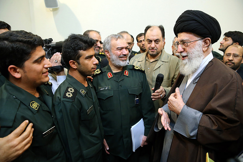 Iran's Supreme Leader Khamenei (R) greeting a group of Revolutionary Guard officers, who were involved in the detention of US Navy sailors earlier this month. (AFP Photo)