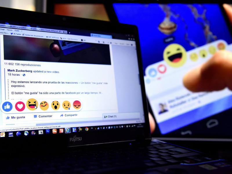 A Facebook user tries out the site's new 'Reactions' feature. (AFP Photo) 