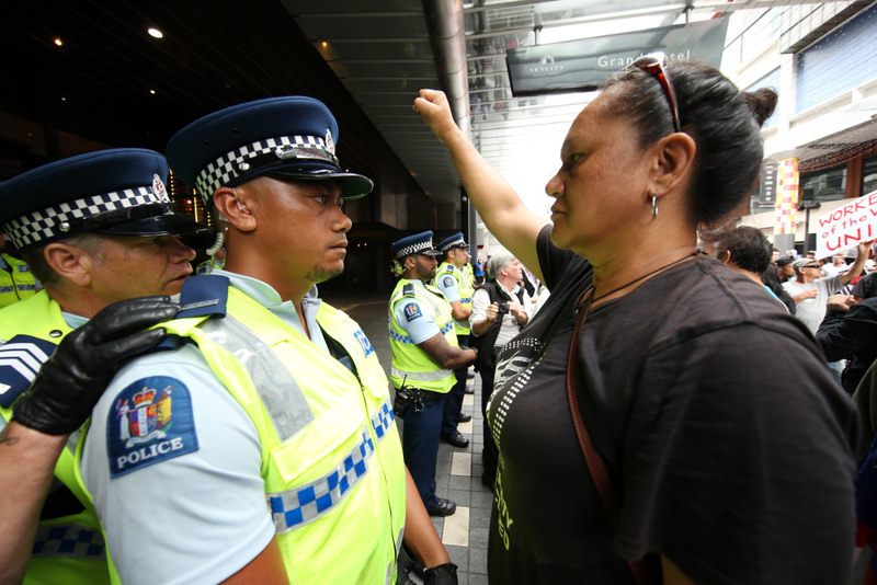 Protestors clash with police outside the venue of the Trans Pacific Partnership agreement signing at the SkyCity Conference Centre in Auckland, New Zealand yesterday.