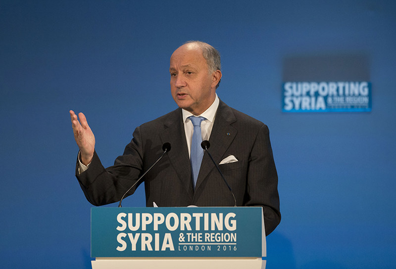 French FM Laurent Fabius makes a pledge during the 'Supporting Syria and the Region' conference, Feb. 4, 2016. (AP Photo)